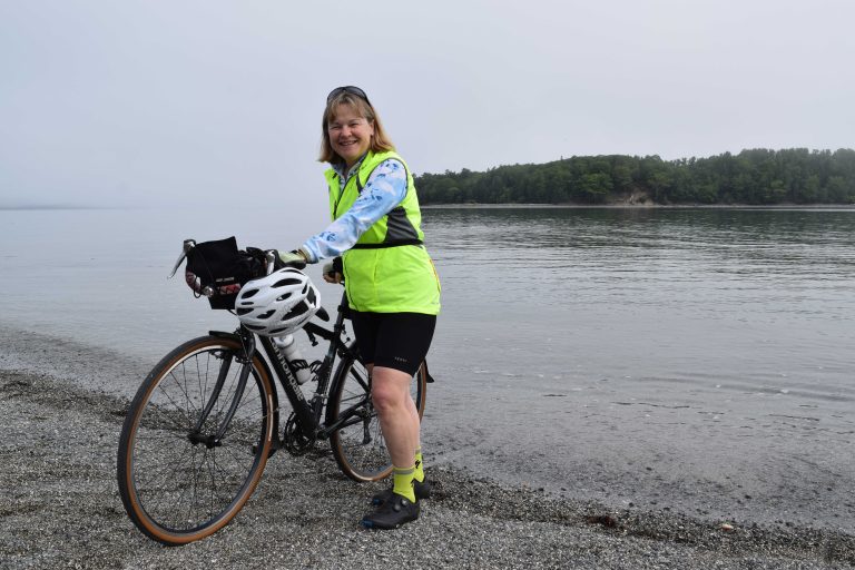 Elizabeth dipping her rear wheel into the Atlantic Ocean